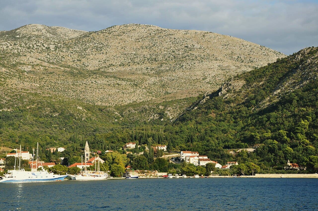Slano bay with the bell tower and wooded hills of the Dubrovnik Riviera