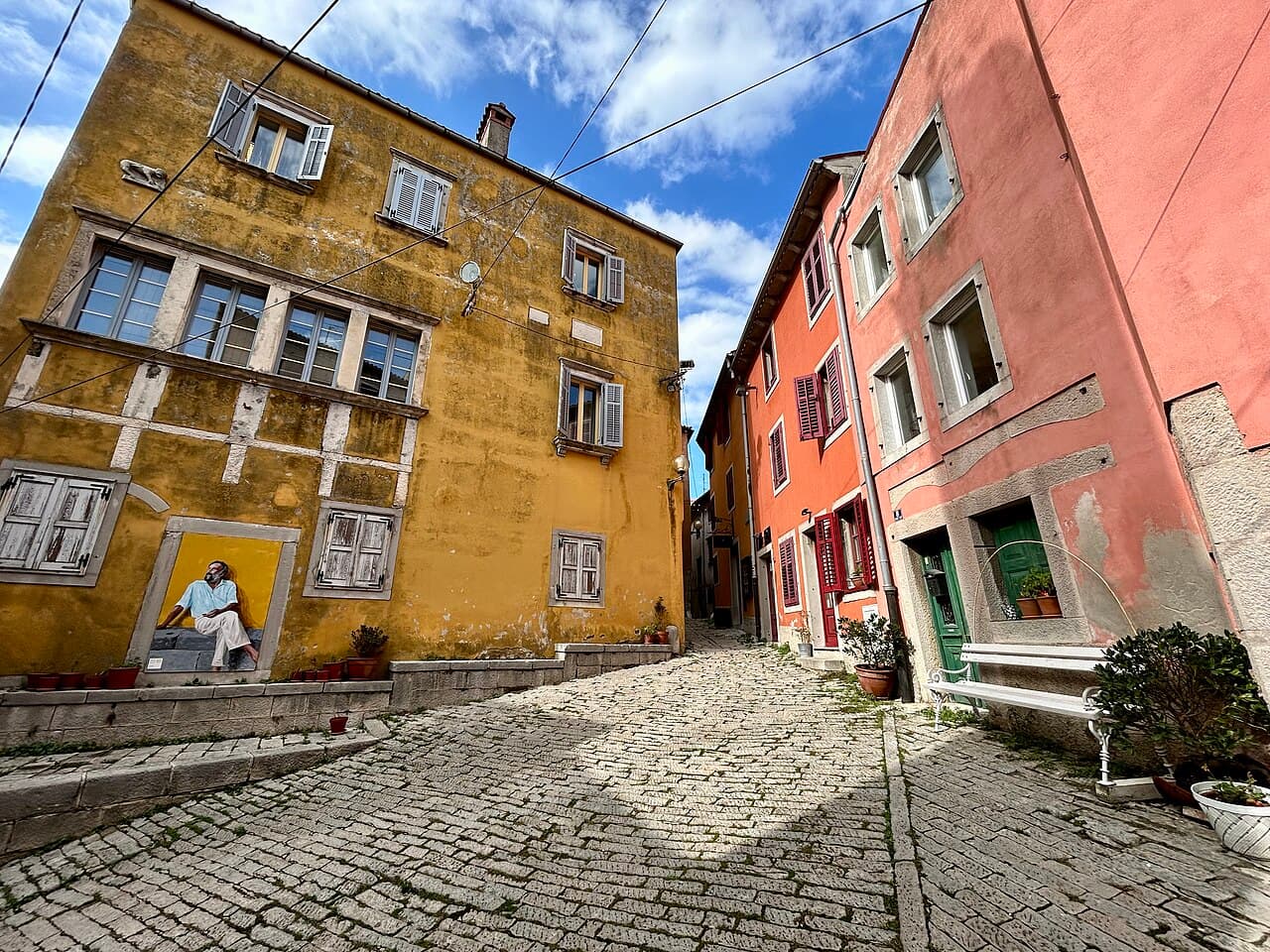 Cobbled square with colourful houses in the old town of Labin