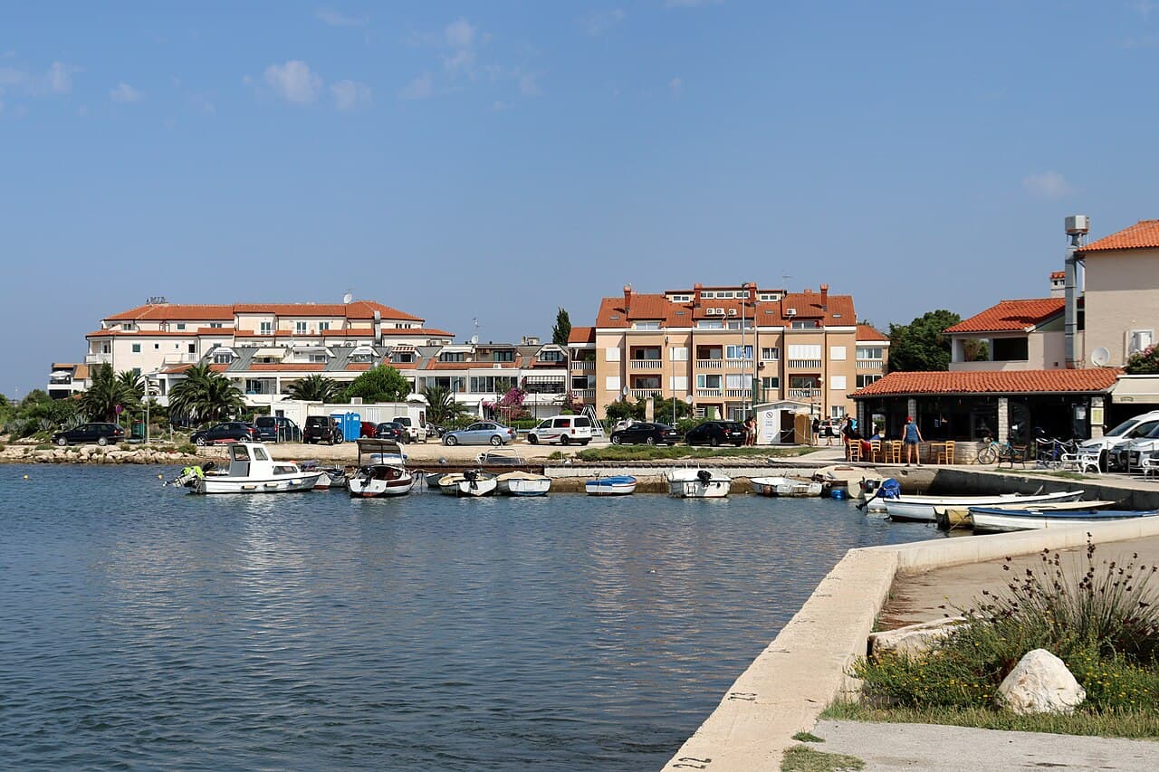 Small harbour and apartment buildings on the Medulin waterfront