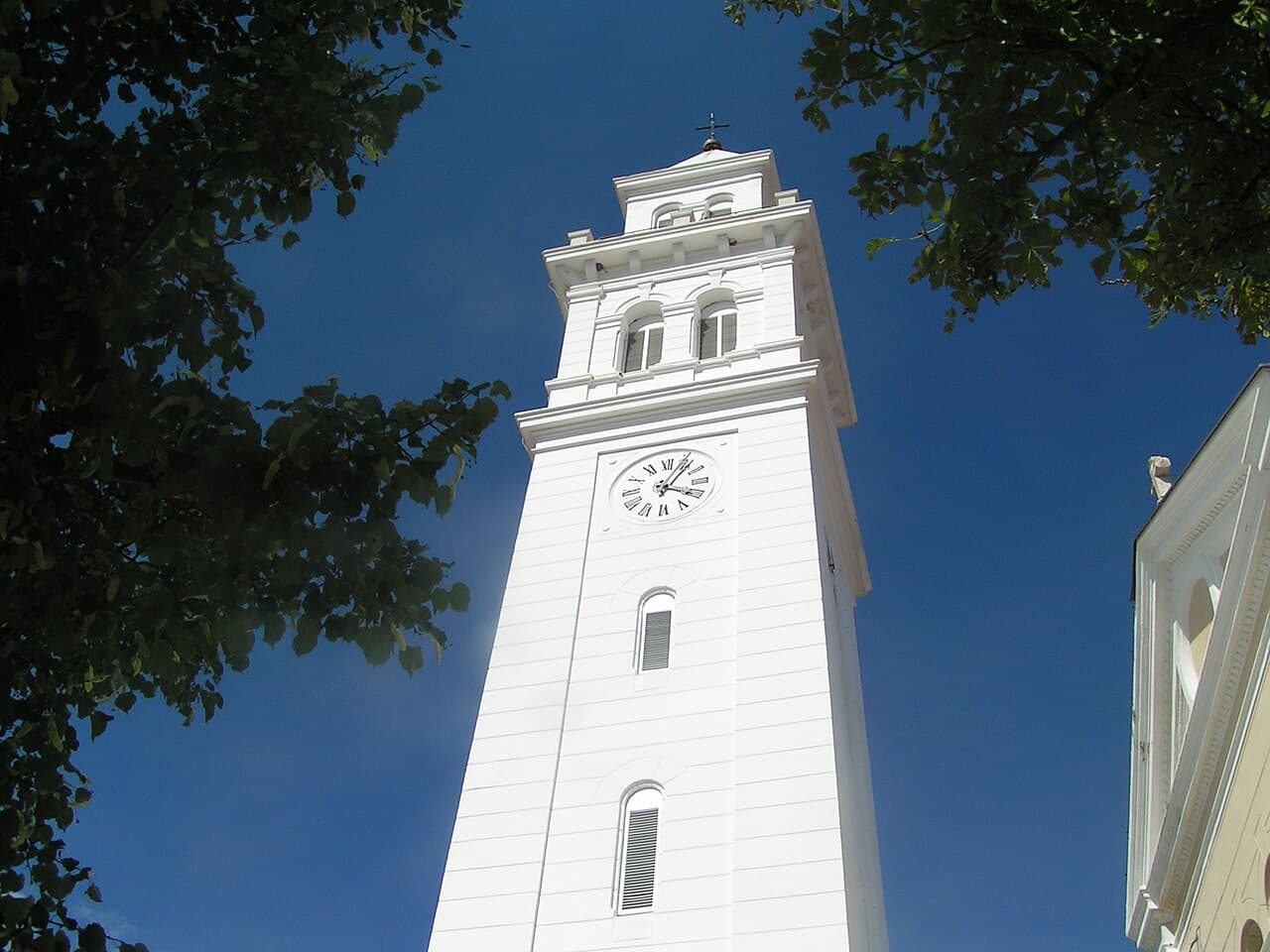 White clock tower of the parish church in Novi Vinodolski