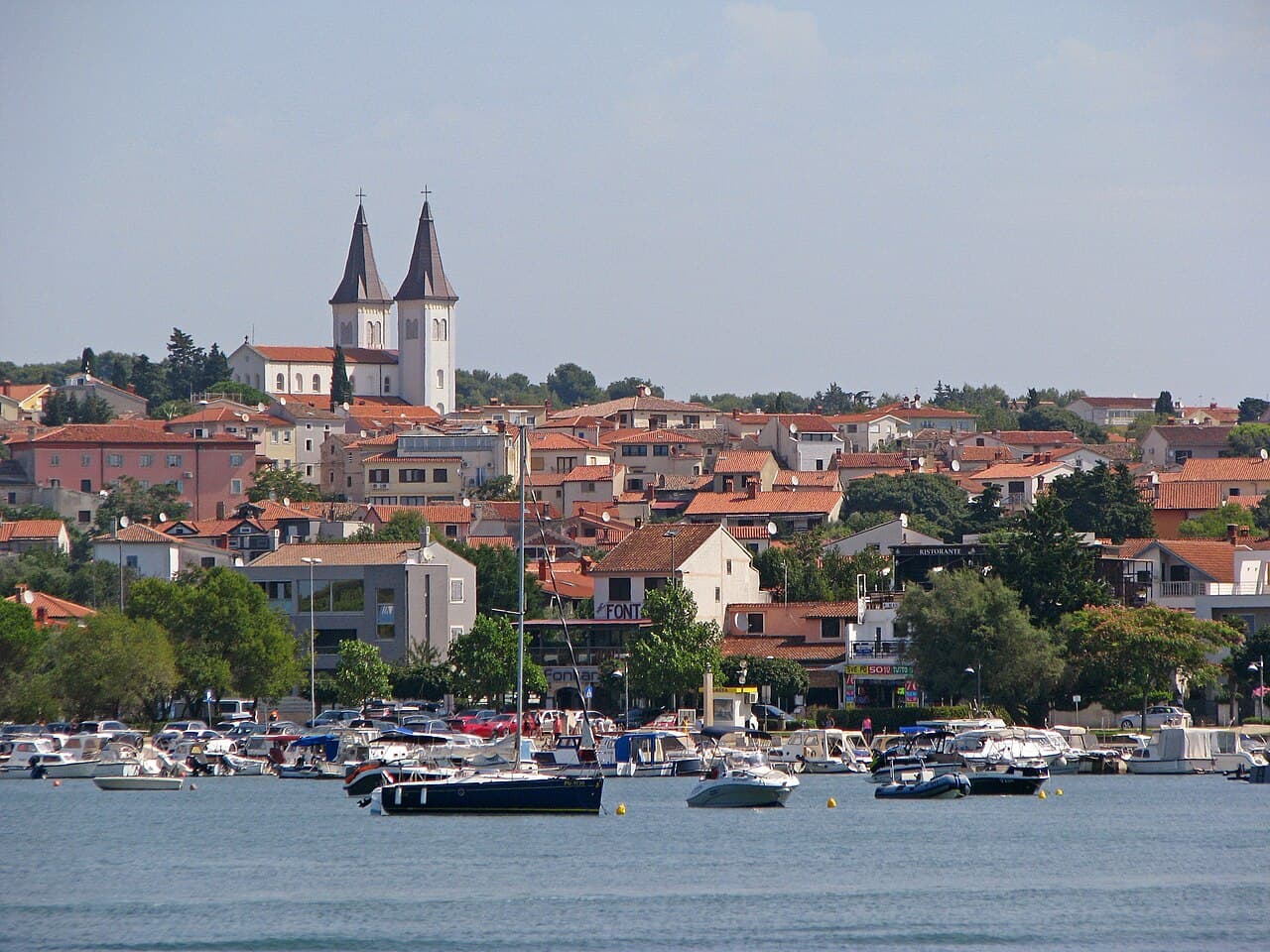 Medulin town and harbour with the twin-towered church